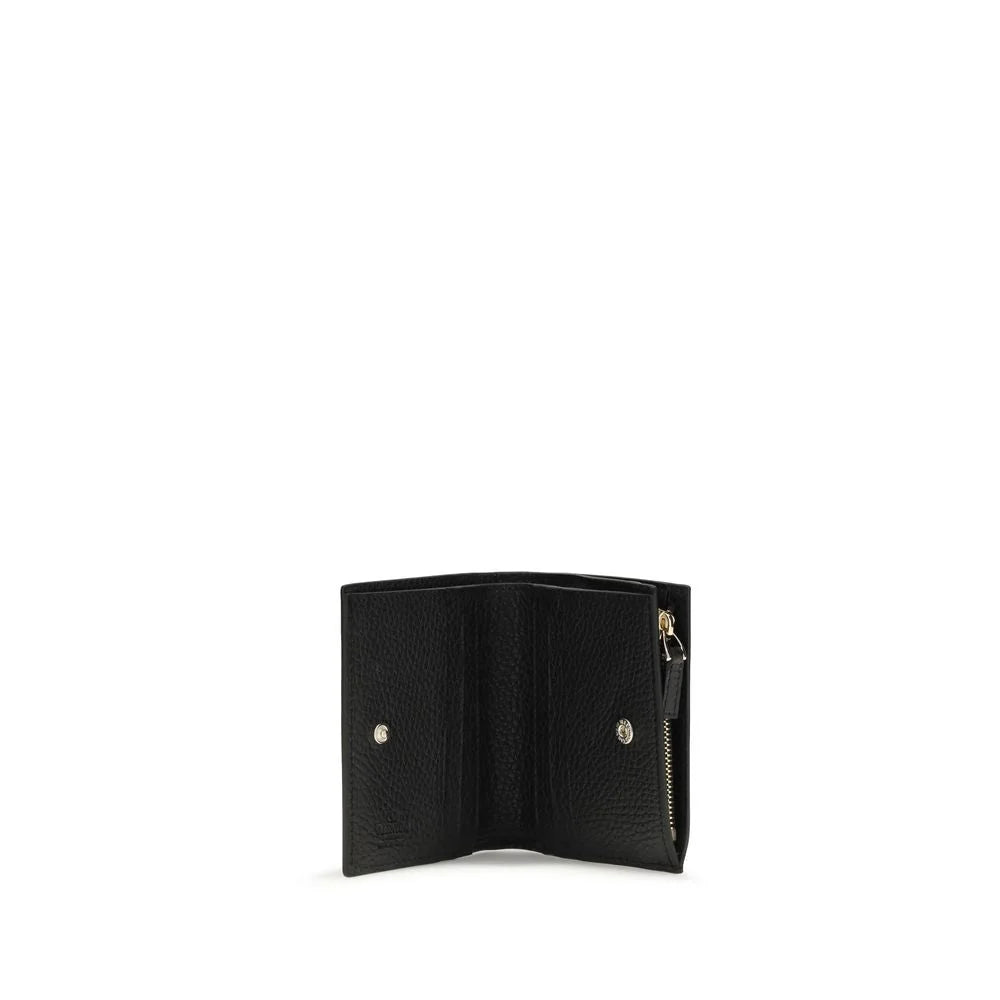 Interior detail of the Valentino Garavani lambskin wallet displaying organized card slots and premium craftsmanship.
