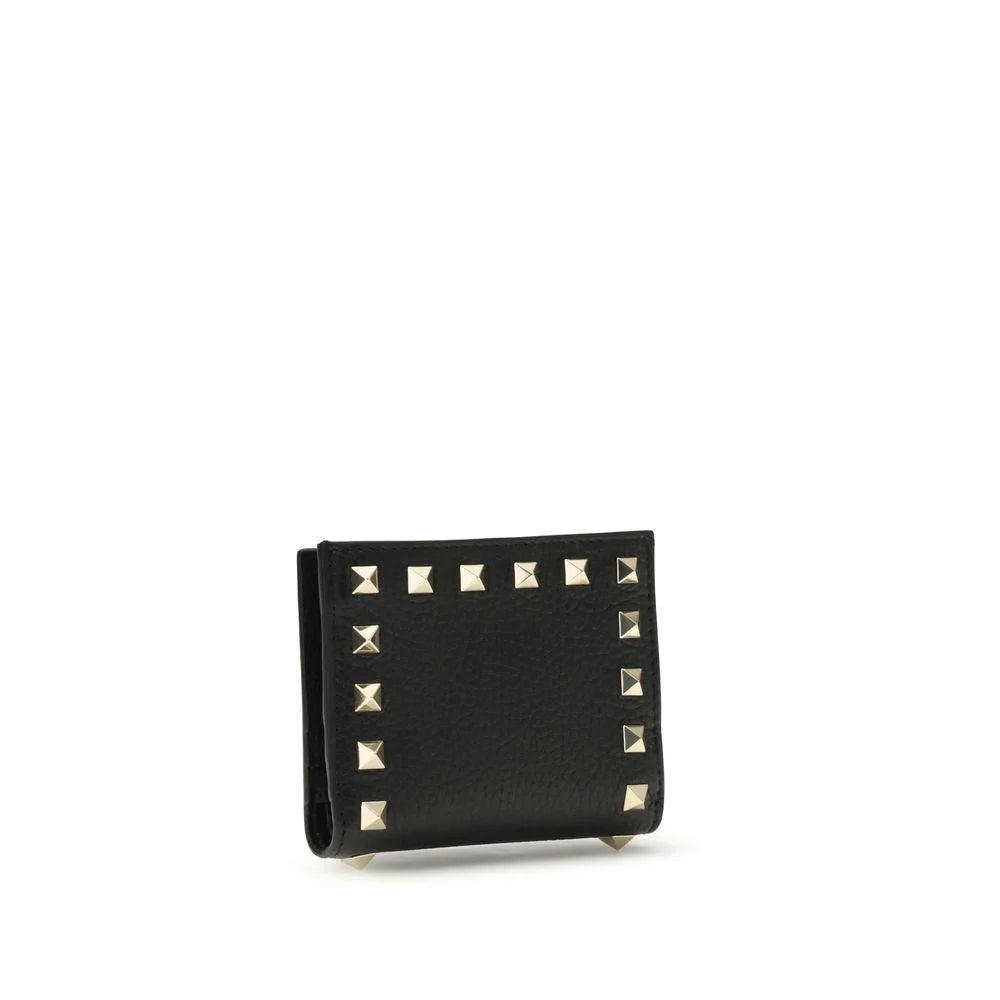 Side view of the Valentino Garavani black leather wallet showcasing its slim profile and refined edge finishing.