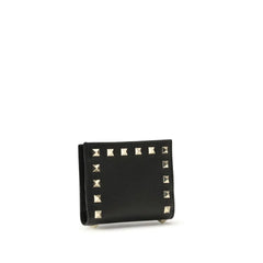Side view of the Valentino Garavani black leather wallet showcasing its slim profile and refined edge finishing.