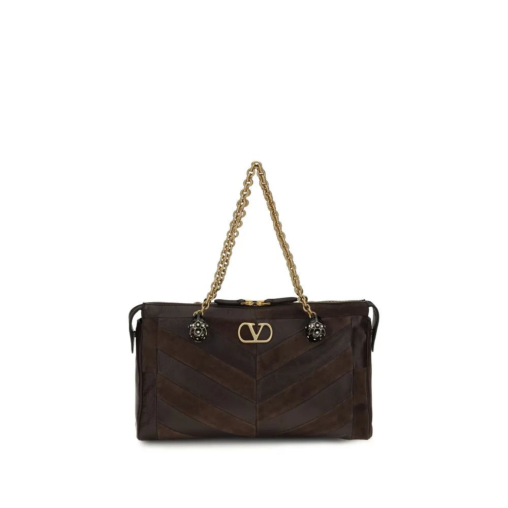 Bolso bandolera de cuero de becerro marrón Bos Taurus de Valentino Garavani con hardware dorado y emblema del logo característico.