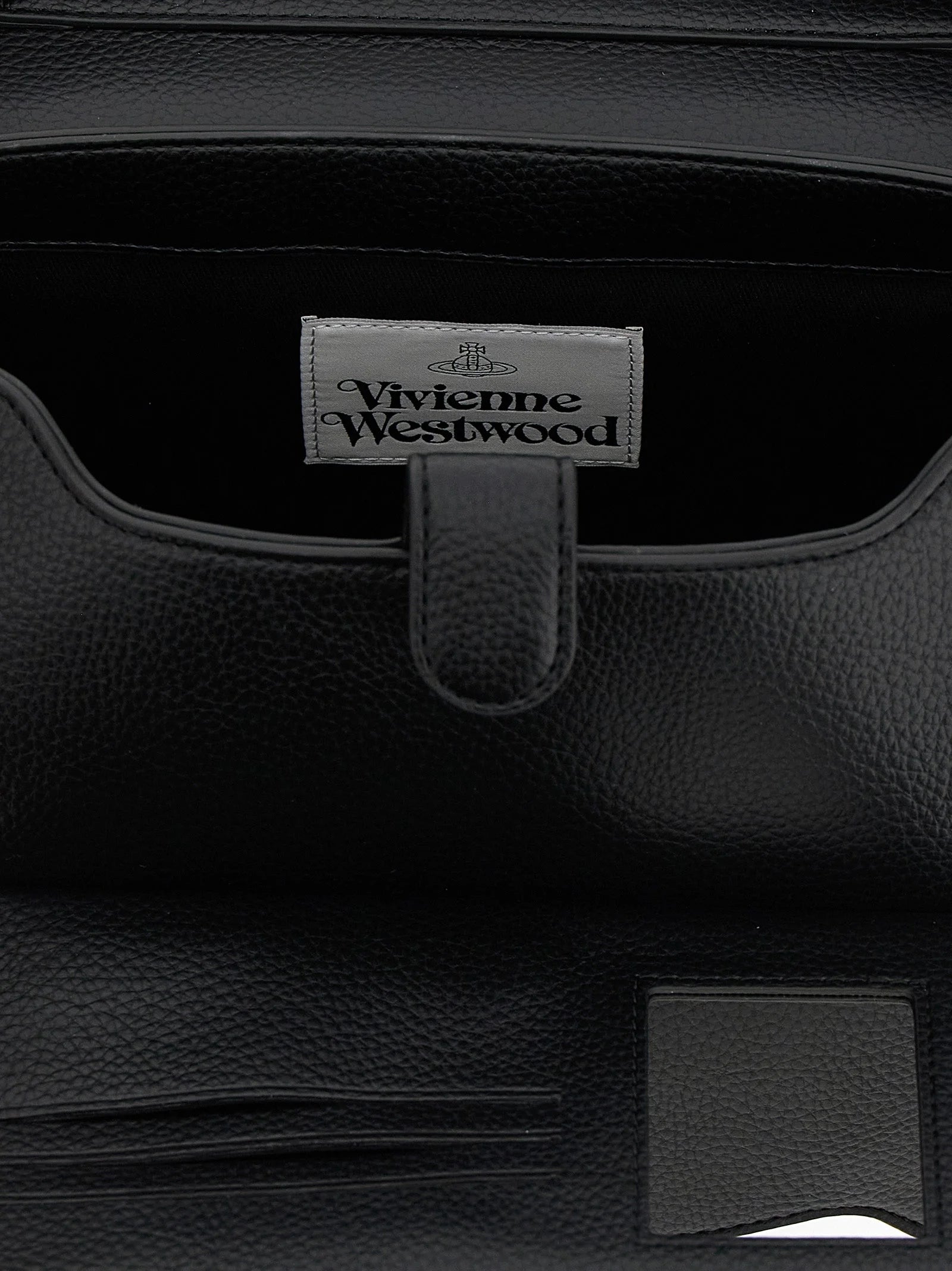 Close-up of the Vivienne Westwood silver Orb hardware and textured polyethylene material on a black shoulder bag.